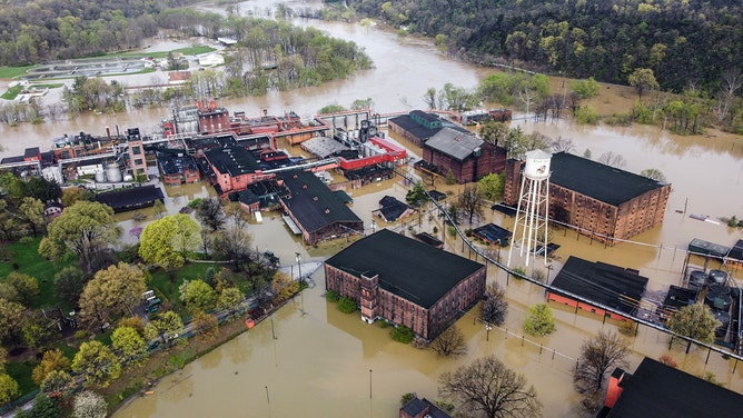 Aerial view of Buffalo Trace Distillery surrounded by floodwaters in Frankfort, Kentuky, after days of heavy rainfall across the Midwest on April 7, 2025.
